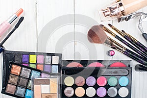 Close up shadow kit with brushes for make-up.beauty background.