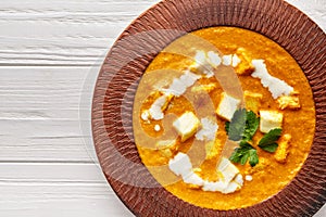 Close up of Shahi paneer texture Indian vegetarian masala gravy meal with vegetables and white sauce