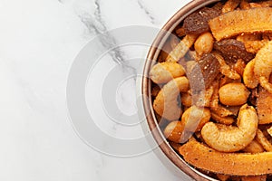 Close-up of  Shahi vrat or upvas or Fasting namkeen Mixture made from coconut,ground nuts, cashew, potato slice, peanut, Indian
