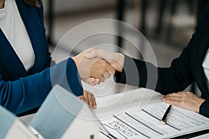 Close up shake hands, Considering buying a home, investing in real estate. Broker signs a sales agreement. agent, lease agreement