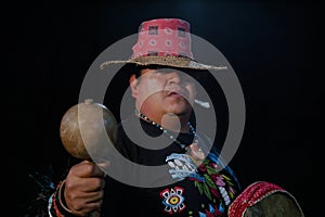 close up of Shaman man, sorcerer, giving thanks duringPre-Hispanic ritual in Healing and cleaning with medicinal plants in Mexico