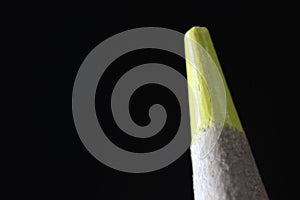 Macro view of the tip of the pencil on a black background