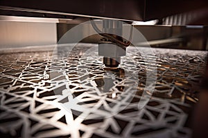 close-up of a sheet of metal being cut using laser or waterjet