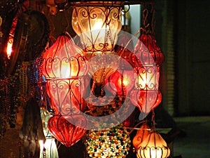 Close up of Shining lanterns in khan el khalili souq market with Arabic handwriting on it in egypt cairo photo