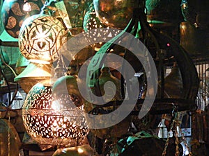 Close up of Shining lanterns in khan el khalili souq market with Arabic handwriting on it in egypt cairo photo