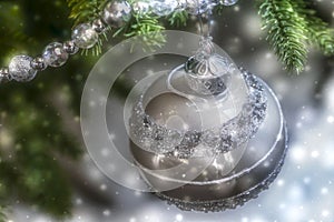 Close up of shiny Christmas ball hanging from tree