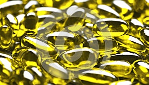 A close-up of shiny, yellow capsules
