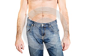 Close up on shirtless men in jeans trousers