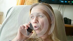 Close up of shocked woman hearing bad news over phone, scared female amazed by negative message received talking on cell