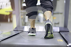 Close up on shoe, Woman training with legs running on treadmill