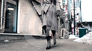 Close up shoes legs of businesswoman walking in modern city hurry time. Business concept. Asian hieroglyph on the