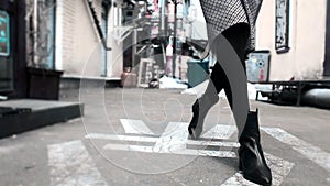 Close up shoes legs of businesswoman walking in modern city hurry time. Business concept. Asian hieroglyph on the