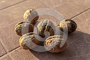 Close-up shoot of batch of walnuts on the table