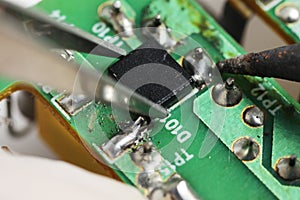 Close up shoot of catching a small electronic component