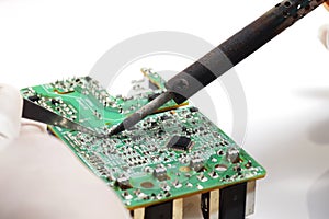 Close up shoot of catching a small electronic component