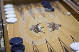 Close-up shoot of dice of backgammon under dim light