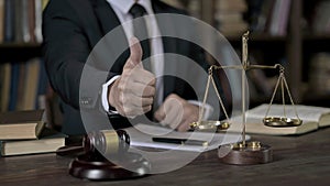 Close up Shoot of Judge Hand showing Big Thumbs Up in Court Room