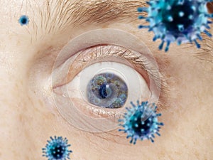 Close up shoot of a male eye with 3D-illustrated coronavirus models, the way of infecting