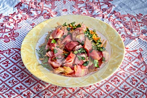 Close-up shoot of oil tomato and carrot salad