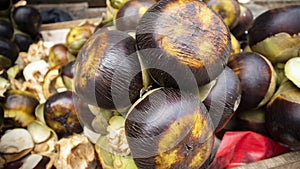 Close up shoot of ripe black palmyra palm on van at street of Dhaka, Bangladesh