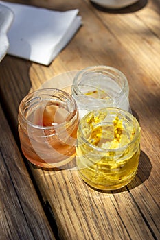 Close-up shoot of traditional sauses, ketchup, mayonnaise, mustard under clean light