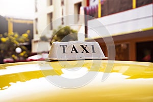 close up shoot of yellow taxi sign
