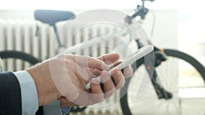 Close Up Shooting with a Businessman Sending a Message Using a Smartphone