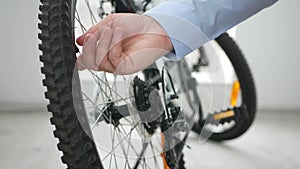 Close-Up Shooting with Man hands Opening a Bicycle Tire Valve For Pressure Check