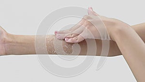 Close-up shooting of woman hands taking cosmetic procedures with aromatic scrab