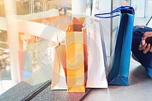 Close up of shopping bags on floor in department store, Lifestyle and shopping concept