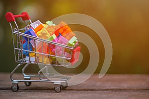 Close up of shopping cart full of legos