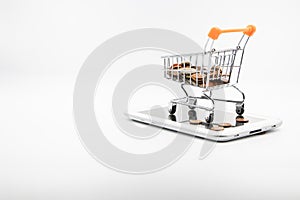 close up Shopping cart on smartphone White background E-commerce