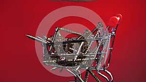 close-up of shopping cart, trolley with screws, construction tools. online store