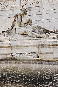 close-up shot of ancient fountains statue element with male figure sculpture,