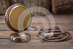 Close up shot of a antique 50s microphone with cables and box.