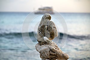 Close-up shot of balanced rocks near the water