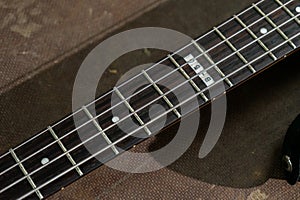 A close-up shot of bass guitar strings showcasing their texture and alignment.