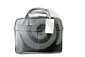 Close up shot of a black leather briefcase with a tag on a white background