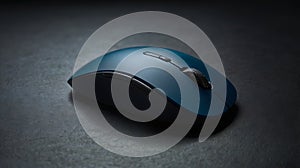 Close up shot of a blue wireless computer mouse on a dark surface