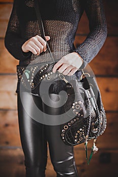 Close up shot of the Boho style leather bag on the girls body