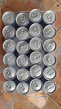 Close up shot of a bunch of soft drink can.