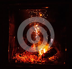 Close up shot of burning firewood in the fireplace