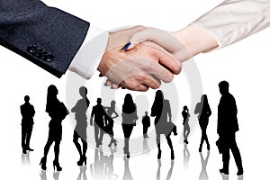 Close-up shot on business handshake over business people croud background.