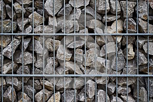 Close-up shot of a cade filled with small rocks