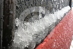 Close-up shot  car glass covered in snow photo
