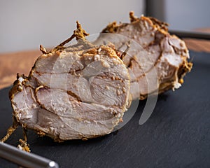 Close-up shot of chicken ham on a chopping board