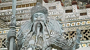 Close up shot of a chinese statue at wat arun temple in bangkok