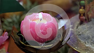 Close up shot of Chinese temple offering of lotus candle