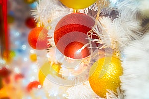 Close-up shot of Christmastide decoration with red and yellow ba photo