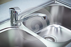 Clean chrome tap and washbasin photo